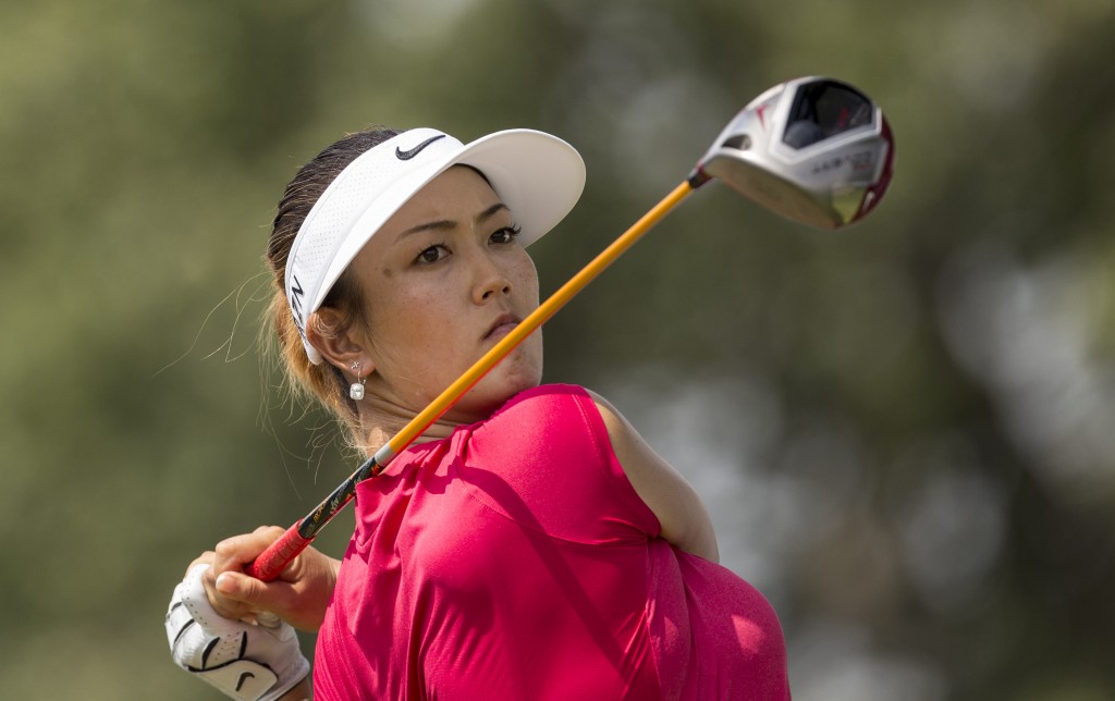 Michelle Wie hits from the 10th tee box during the second round of the NW Arkansas Championship golf tournament on Sunday, June 29, 2014, in Rogers, Ark. (AP Photo/Beth Hall)