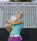 Michelle Wie poses with the trophy after winning the U.S. Women's Open golf tournament in Pinehurst, N.C., Sunday, June 22, 2014. (AP Photo/Bob Leverone)