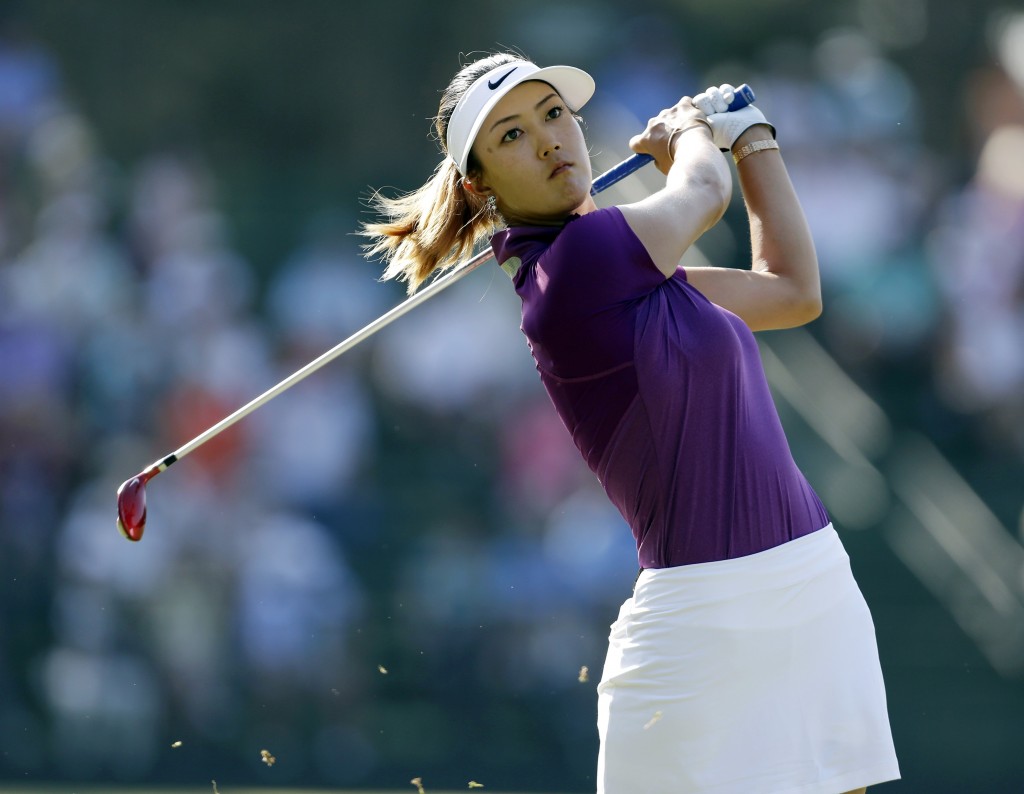 Michelle Wie watches her tee shot on the 13th hole during the second round of the U.S. Women's Open golf tournament in Pinehurst, N.C., Friday, June 20, 2014. (AP Photo/Bob Leverone)