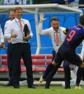 Netherlands' Robin van Persie celebrates with Netherlands' head coach Louis van Gaal after scoring a goal during the group B World Cup soccer match between Spain and the Netherlands at the Arena Ponte Nova in Salvador, Brazil, Friday, June 13, 2014. (AP Photo/Bernat Armangue)