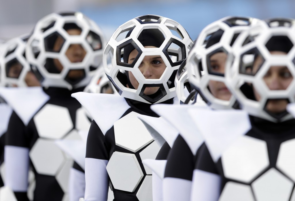 Actors perform during the opening ceremony before the group A World Cup soccer match between Brazil and Croatia, the opening game of the tournament, in the Itaquerao Stadium in Sao Paulo, Brazil, Thursday, June 12, 2014.  (AP Photo/Andre Penner)