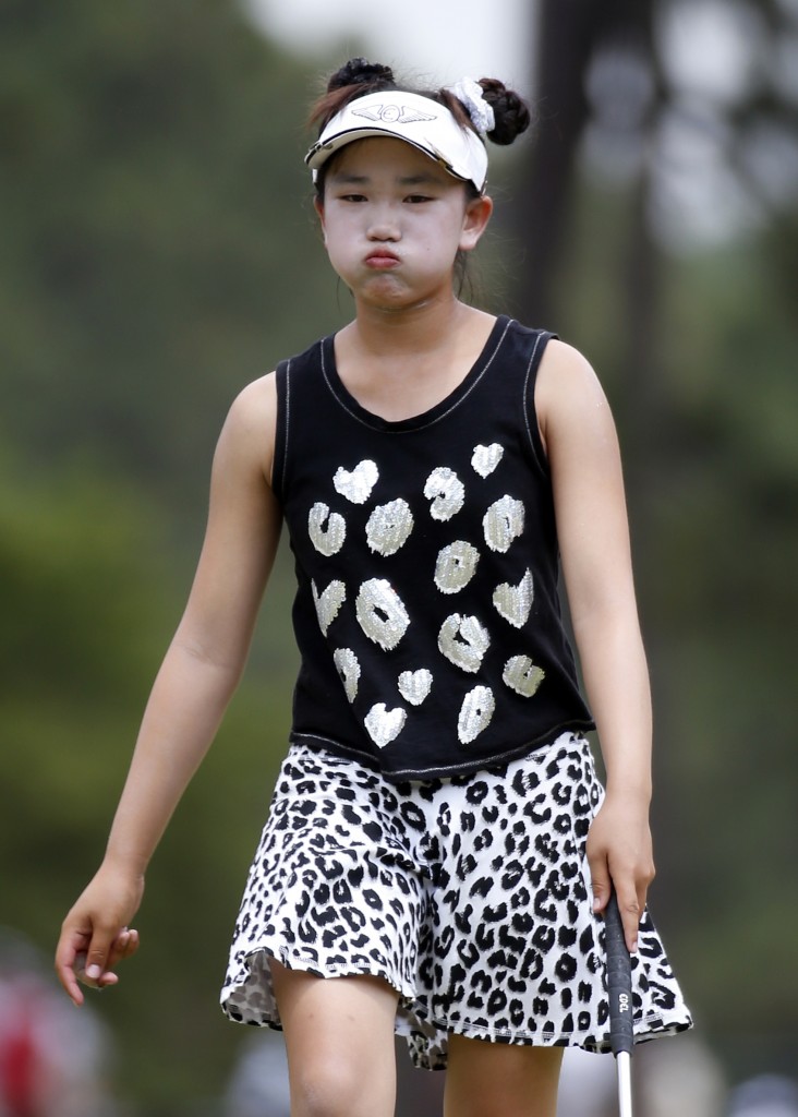 Lucy Li reacts after missing a birdie putt on the seventh hole during the second round of the U.S. Women's Open golf tournament in Pinehurst, N.C., Friday, June 20, 2014. (AP Photo/John Bazemore)