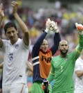United States' goalkeeper Tim Howard (1) and his teammates celebrate after qualifying for the next World Cup round following their 1-0 loss to Germany during the group G World Cup soccer match between the USA and Germany at the Arena Pernambuco in Recife, Brazil, Thursday, June 26, 2014. (AP Photo/Ricardo Mazalan)