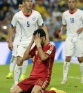 Spain's Sergio Busquets reacts after missing a chance during the group B World Cup soccer match between Spain and Chile at the Maracana Stadium in Rio de Janeiro, Brazil, Wednesday, June 18, 2014.  (AP Photo/Manu Fernandez)