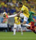 Brazil's Neymar controls a ball during the group A World Cup soccer match between Cameroon and Brazil at the Estadio Nacional in Brasilia, Brazil, Monday, June 23, 2014. (AP Photo/Dolores Ochoa)