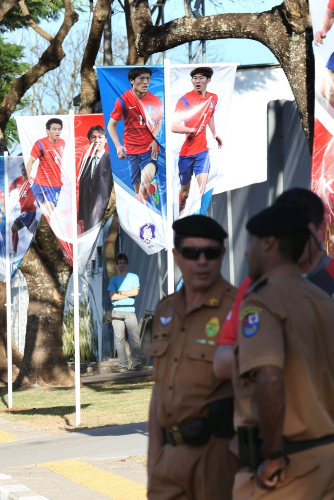 Sao Paulo police stand in front of World Cup banners.