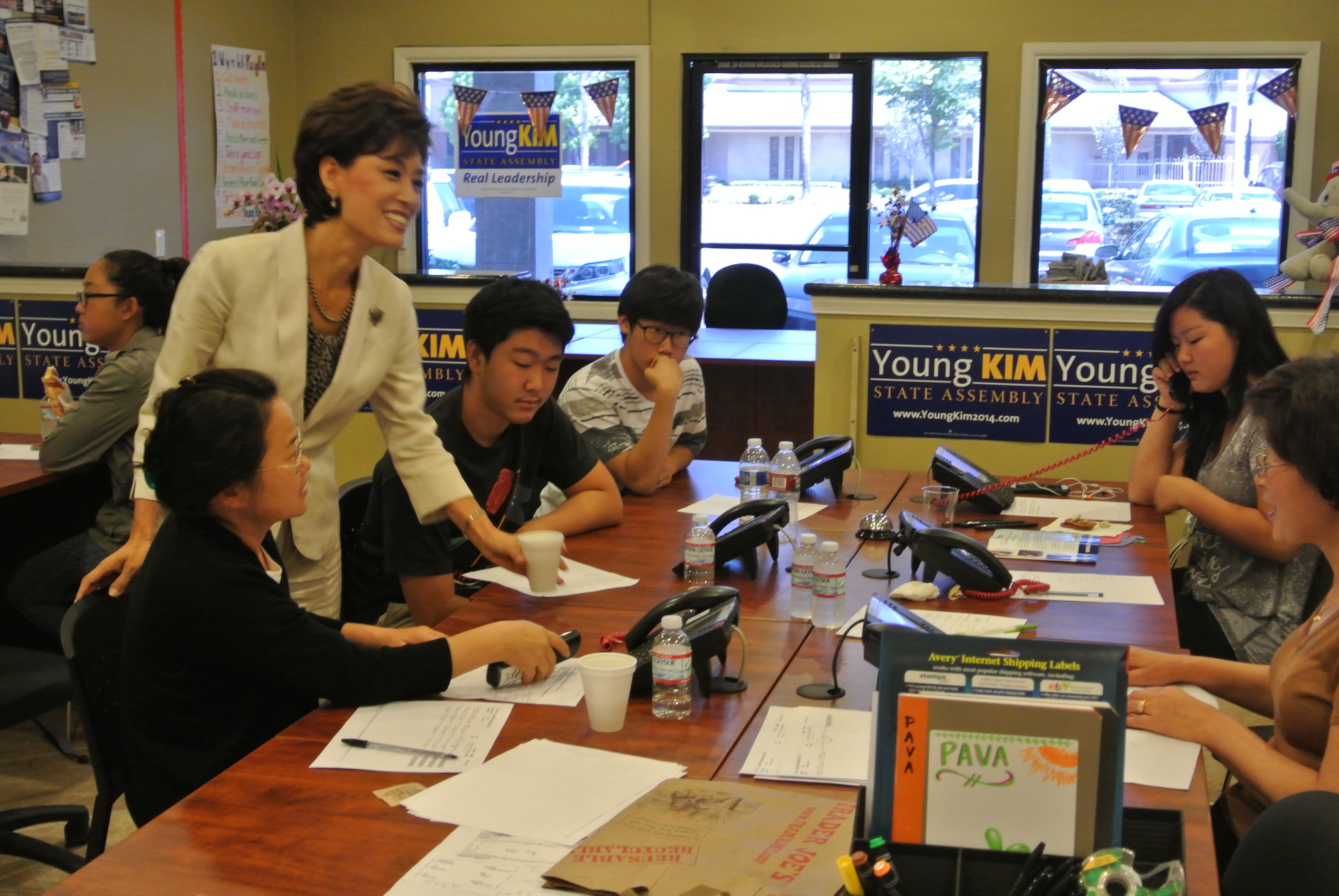 Young Kim, a Republican candidate for the 65th District seat in the State Assembly, encourages volunteer workers inside her Buena Park office.