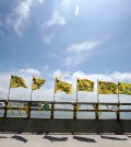 Flags written with the names of 10 victims of the Sewol sinking wave in the wind in Jindo. (Hyung Min-woo/Yonhap)