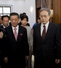 Song Il Ho, North Korea's ambassador in charge of normalizing relations with Japan, center left, and Junichi Ihara, head of the Japanese Foreign Ministry's Asian and Oceanian Affairs Bureau, center right, arrive for a meeting at the North Korean Embassy in Beijing, China Tuesday, July 1, 2014. (AP Photo/Andy Wong)