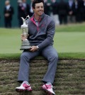 Rory McIlroy of Northern Ireland holds the Claret Jug trophy after winning the British Open Golf championship at the Royal Liverpool golf club, Hoylake, England, Sunday July 20, 2014. (AP Photo/Peter Morrison)