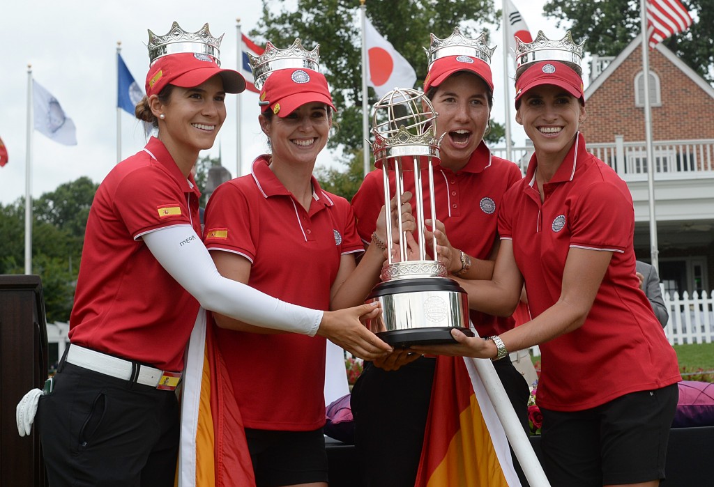 From left to right, Belen Mozo, Beatriz Recari, Carlota Ciganda and Azahara Munoz, all of Spain, hold the trophy after winning the International Crown golf tournament Sunday, July 27, 2014, in Owings Mills, Md. (AP Photo/Gail Burton)