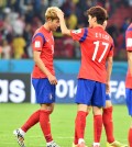 Son Heung-min, left, is about to walk away with the World Cup of hair title. (Newsis)