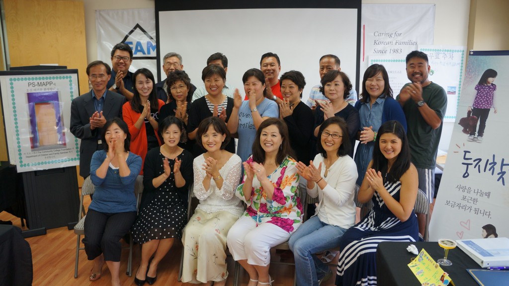 Families seeking foster home licenses through the Korean Foster Family Initiative attend a completion ceremony with KFAM Executive Director Connie Chung, front left. (Jung Goo-hoon/The Korea Times)