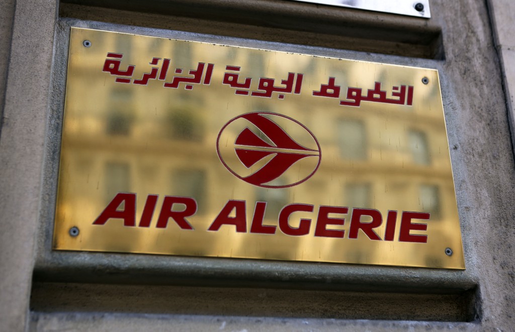The logo of the Air Algerie company office, at the Opera avenue in Paris Thursday July 24, 2014. A flight operated by Air Algerie has disappeared from radar while traveling from Burkina Faso in West Africa to Algiers. Authorities say it was carrying over 100 passengers and crew when air navigation services lost track of the Swiftair plane 50 minutes after takeoff earlier this morning. (AP Photo/Remy de la Mauviniere)