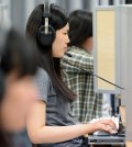 A student takes a high school English exam in Seoul. (Kim Joo-sung / The Korea Times)