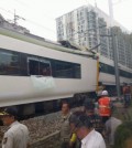 Rescuers stand beside a damaged train on a rail track in Taebaek, Gangwon Province, Tuesday. (Yonhap)