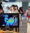 A thermal camera monitor shows the body temperature of passengers arriving from overseas against possible infections of Ebola virus at the Incheon International Airport in Incheon, South Korea, Friday, Aug. 8, 2014. South Korea has been stepping up monitoring of its citizens returning from trips to West Africa and other areas affected by the deadly Ebola virus. (Yonhap)