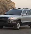 This undated photo provided by Hyundai shows the 2005 Hyundai Santa Fe. Hyundai is recalling more than 419,000 cars and SUVs to fix suspension, brake and oil leak problems. The biggest of three recalls posted Friday, Aug. 1, 2014, by U.S. safety regulators is of 225,000 Santa Fe SUVs from 2001-2006 to replace front coil springs that can rust and crack in cold-weather states. The springs can fracture and make contact with a tire, potentially causing a crash. (AP Photo/Hyundai)