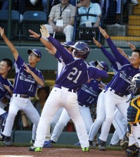 South Korea's Hae Chan Choi (21) celebrates with teammates after hitting a two-run home run off Chicago's Brandon Green in the sixth inning of the Little League World Series championship baseball game in South Williamsport, Pa., Sunday, Aug. 24, 2014. (AP Photo/Gene J. Puskar)