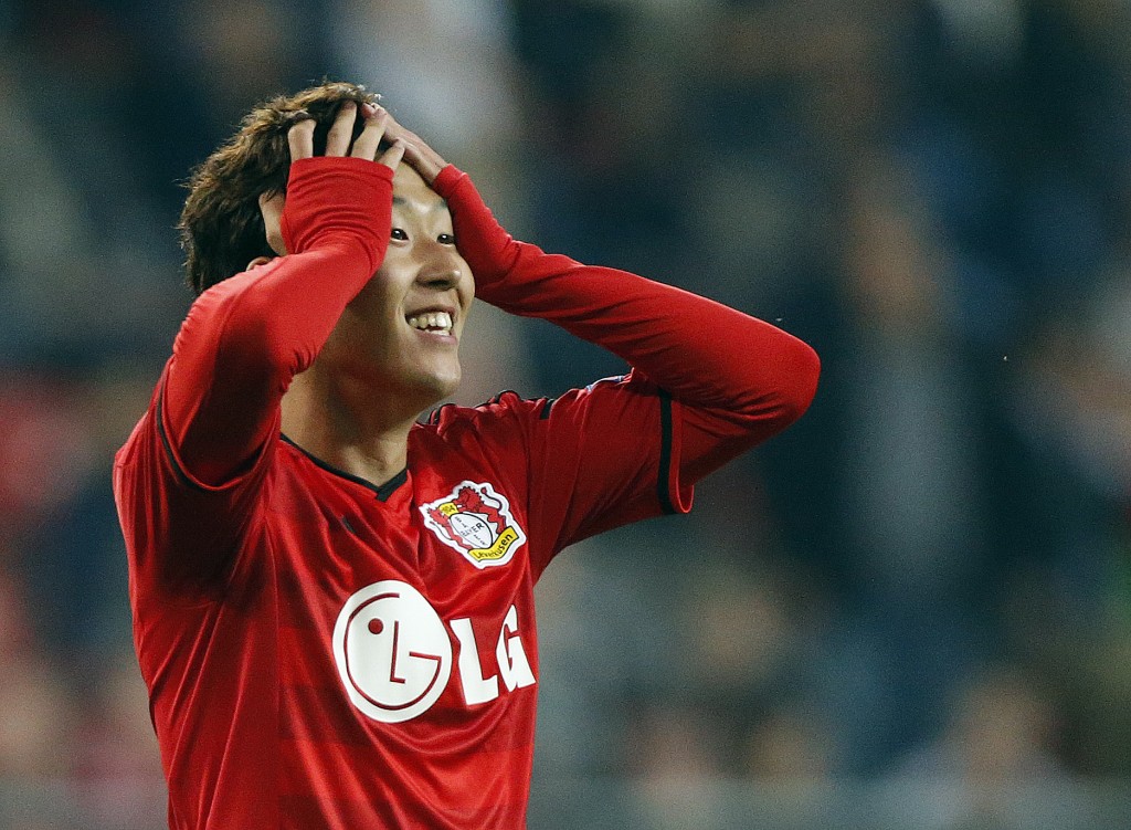 Leverkusen's Son Heung-min holds his head  during the Champions League qualifying soccer match between Bayer 04 Leverkusen and FC Copenhagen in Leverkusen, Germany, Wednesday, Aug.27,2014. (AP Photo/Frank Augstein)