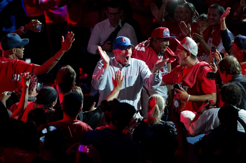 New Los Angeles Clippers owner Steve Ballmer, center, fires up the crowd as he arrives at the Clippers Fan Festival on Monday, Aug. 18, 2014, in Los Angeles. (AP Photo/Jae C. Hong)