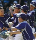South Korea's Hae Chan Choi, center, celebrates with teammates after getting the final out of a 8-4 win in the Little League World Series championship baseball game against Chicago in South Williamsport, Pa., Sunday, Aug. 24, 2014. (AP Photo/Gene J. Puskar)