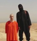 This undated image shows a frame from a video released by Islamic State militants Tuesday, Aug. 19, 2014, that purports to show the killing of journalist James Foley by the militant group. Foley, from Rochester, N.H., went missing in 2012 in northern Syria while on assignment for Agence France-Press and the Boston-based media company GlobalPost. (AP Photo)