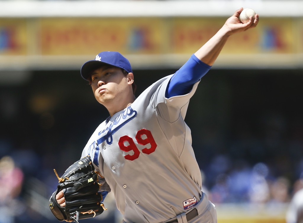 Los Angeles Dodgers starting pitcher Hyun-Jin Ryu works against the San Diego Padres in the first inning of a baseball game Sunday, Aug. 31, 2014, in San Diego.  (AP Photo/Lenny Ignelzi)