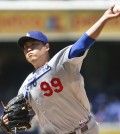 Los Angeles Dodgers starting pitcher Hyun-Jin Ryu works against the San Diego Padres in the first inning of a baseball game Sunday, Aug. 31, 2014, in San Diego.  (AP Photo/Lenny Ignelzi)