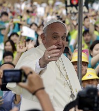 Pope Francis blesses upon arrival for the Closing Holy Mass of the 6th Asian Youth Day at Haemi Castle in Seosan, south of Seoul, South Korea, Sunday, Aug. 17, 2014. (AP Photo/Lee Jin-man, Pool)