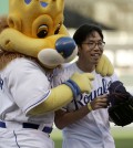 Longtime Kansas City Royals fan Lee Sung Woo is confident that the Royals deserve their postseason success (AP Photo/Charlie Riedel)