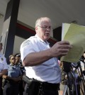 Ferguson Police Chief Thomas Jackson releases the name of the the officer accused of fatally shooting Michael Brown, an unarmed black teenager,  Friday, Aug. 15, 2014, in Ferguson, Mo.  Jackson announced that the officer's name is Darren Wilson. (AP Photo/Jeff Roberson)