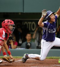 Japan catcher Shingo Tomita, left,  misses the tag as South Korea's Jin Woo Jeon scores on a single by Ji Ho Park in the second inning of an International Championship baseball game at the Little League World Series tournament in South Williamsport, Pa., Saturday Aug. 23, 2014. (AP Photo/Gene J. Puskar)