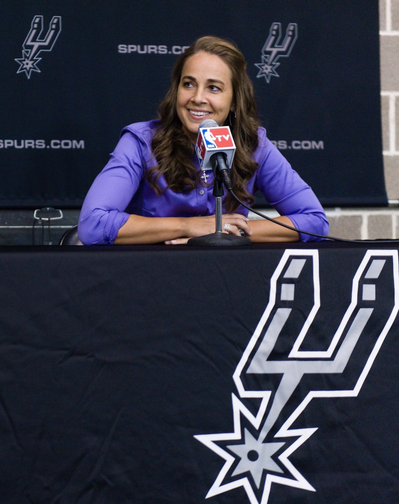 WNBA star Becky Hammon takes questions from the media at the San Antonio Spurs practice facility after being introduced as an assistant coach with the team on Tuesday, Aug. 5, 2014 in San Antonio. The San Antonio Spurs hired WNBA star Becky Hammon on Tuesday, making her the first full-time, paid female assistant on an NBA coaching staff.  (AP Photo/Bahram Mark Sobhani)