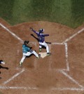 South Koreas Ji Ho Park (10), Dong Hwan Ahn (6) and Puerto Ricos Emanuel Alicea (13) react to a safe call from home plate umpire Garry Smith after Park scored on a wild pitch during the sixth inning of an International double elimination baseball game at the Little League World Series, Sunday, Aug. 17, 2014, in South Williamsport, Pa. South Korea won 8-5. (AP Photo/Matt Slocum)