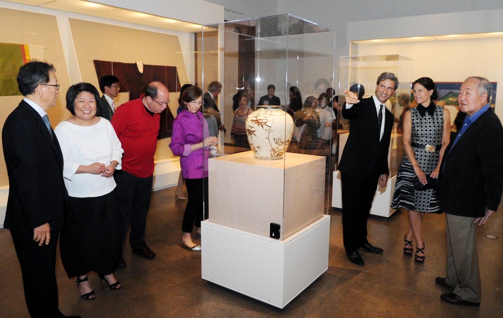 LACMA Director Michael Govan, third from left, takes a photo at the "Treasures of Korea" exhibition on display at LACMA from June 29 to Sept. 28.