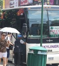 A man steps onto a casino bus on Roosevelt Ave. in Flushing, Queens, on July 31.