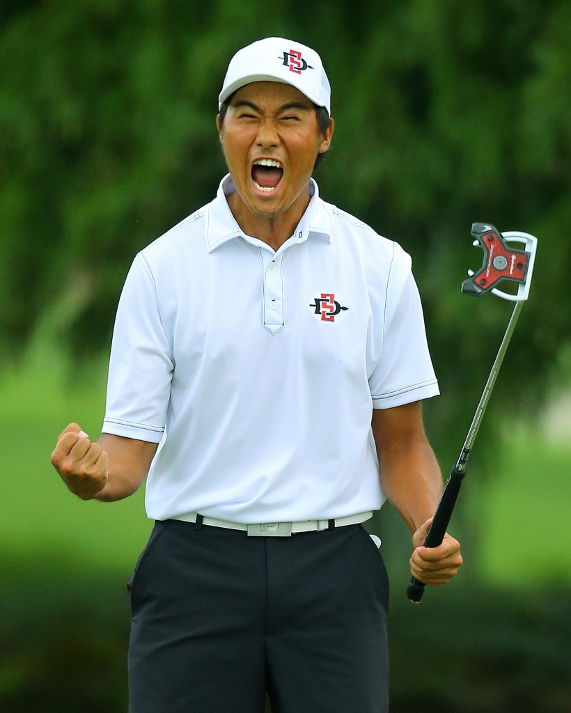 Yang Gunn, of San Diego, Calif., reacts to sinking his par putt on the 17th hole during the afternoon round to win the 36-hole championship match of the 2014 U.S. Amateur Championship at Atlanta Athletic Club on Sunday, Aug.17, 2014, in Johns Creek, Ga. (AP Photo/Atlanta Journal-Constitution, Curtis Compton)