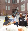 Parents wait for their kindergartners at P.S. 159 in Queens.