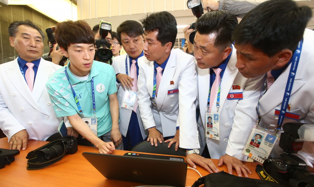 At  the Asian Games press center in Yeonsu-gu, Incheon, North Korean reporters are being informed that they are blocked from accessing a North Korean website. Due to South Korea's National Security Law, the reporters have to send their reports to Pyongyang via fax machine.  (Yonhap) 