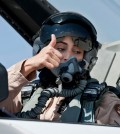 This June 13, 2013 photo provided by the Emirates News Agency, WAM, shows Mariam al-Mansouri, the first Emirati female fighter jet pilot gives the thumbs up as she sits in the cockpit of an aircraft, in United Arab Emirates. A senior United Arab Emirates diplomat says the Gulf federation’s first female air force pilot helped carry out airstrikes against Islamic State militants earlier this week. The Emirati embassy in Washington said on its official Twitter feed Thursday, Sept. 25, 2014 that Ambassador Yousef al-Otaiba confirmed the F-16 pilot’s role. Rumors had swirled on social media that Maj. Mariam al-Mansouri was involved in the strikes, but Emirati officials had not previously confirmed that was the case.(AP Photo/Emirates News Agency, WAM)