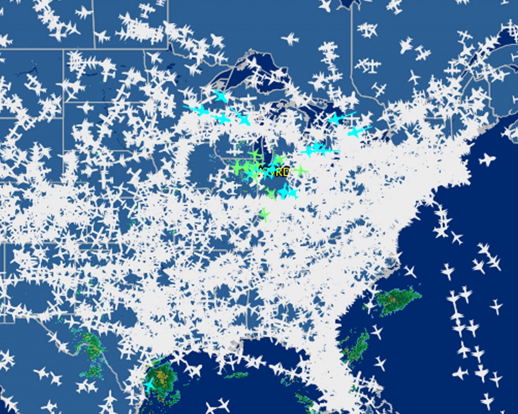 This screen shot provided by FlightAware shows airline traffic at 10:20 a.m. EDT over the United States Friday, Sept. 26, 2014, after hundreds of flights were canceled at Chicago airports, at center, following a fire at a suburban Chicago air traffic control facility. The ground stop threatened to send delays and cancellations rippling throughout the nation's air travel network, as more than 500 flights had already been canceled in Chicago and more were expected. (AP Photo/Courtesy FlightAware)