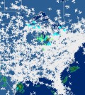 This screen shot provided by FlightAware shows airline traffic at 10:20 a.m. EDT over the United States Friday, Sept. 26, 2014, after hundreds of flights were canceled at Chicago airports, at center, following a fire at a suburban Chicago air traffic control facility. The ground stop threatened to send delays and cancellations rippling throughout the nation's air travel network, as more than 500 flights had already been canceled in Chicago and more were expected. (AP Photo/Courtesy FlightAware)