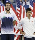 Marin Cilic, of Croatia, left, and Kei Nishikori, of Japan, stand for the trophy ceremony after Cilic defeated Nishikori in the championship match of the 2014 U.S. Open tennis tournament, Monday, Sept. 8, 2014, in New York. (AP Photo/Darron Cummings)