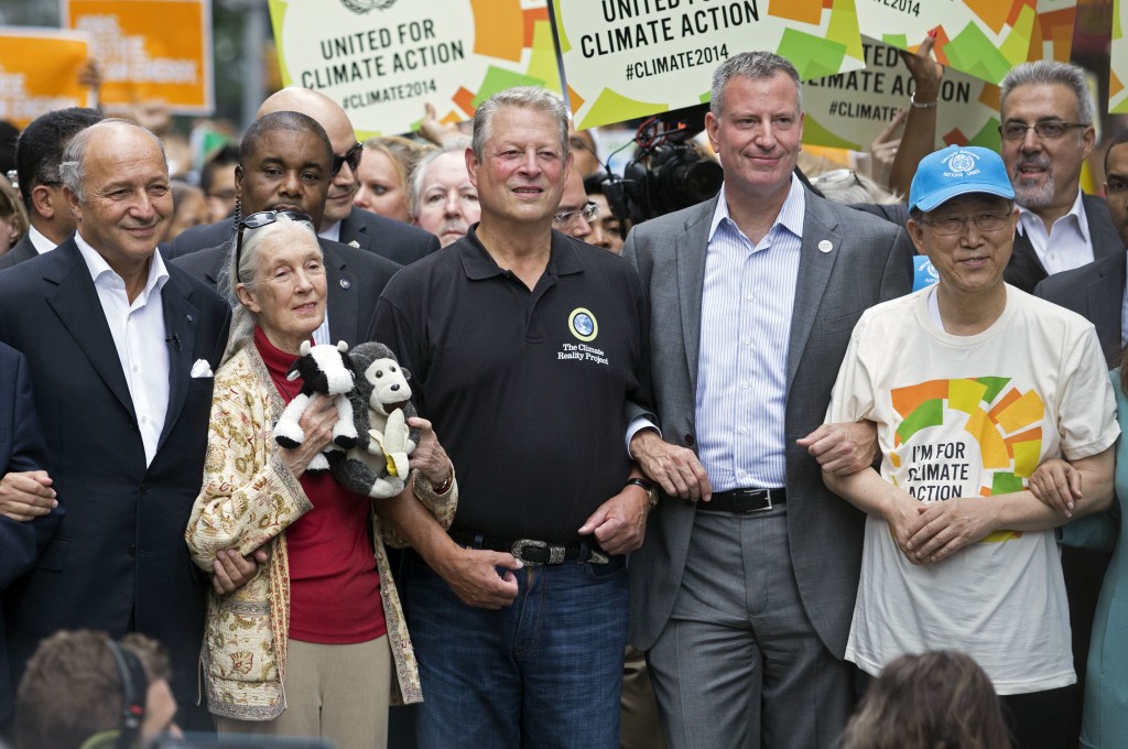 French Foreign Minister Laurent Fabius, from left, primatologist Jane Goodall, former U.S. Vice President Al Gore, New York Mayor Bill de Blasio, and  U.N. Secretary General Ban Ki-moon participate in the People's Climate March in New York, Sunday, Sept. 21, 2014. Thousands of demonstrators filled the streets of Manhattan on Sunday, accompanied by drumbeats, wearing costumes and carrying signs as they urged policy makers to take global action on climate change. (AP Photo/Craig Ruttle)