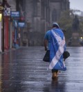 A lone YES campaign supporter walks down a street in Edinburgh after the result of the Scottish independence referendum, Scotland, Friday, Sept. 19, 2014. Scottish voters have rejected independence and decided that Scotland will remain part of the United Kingdom. The result announced early Friday was the one favored by Britain's political leaders, who had campaigned hard in recent weeks to convince Scottish voters to stay. It dashed many Scots' hopes of breaking free and building their own nation. (AP Photo/PA, Stefan Rousseau)