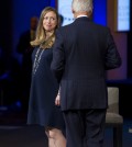 Chelsea Clinton glances at her father, former President Bill Clinton, during the closing session of the Clinton Global Initiative in New York Wednesday, Sept. 24, 2014. (AP Photo/Craig Ruttle)