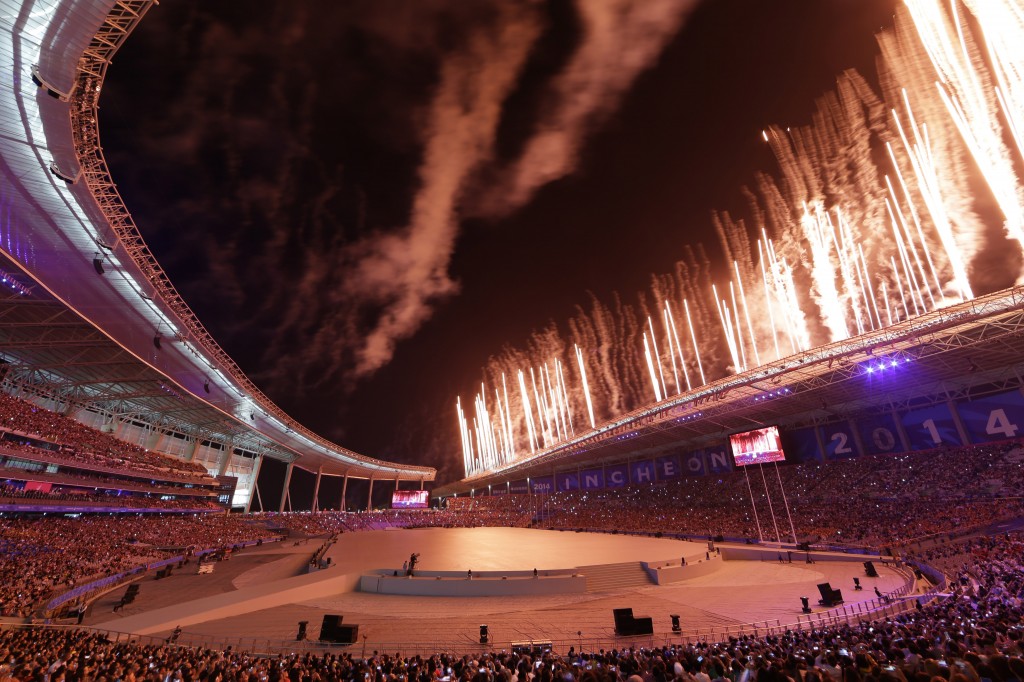 Fireworks explode from the roof of the Asiad Stadium during the opening ceremony for the 17th Asian Games in Incheon, South Korea,Friday, Sept. 19, 2014. (AP Photo/Dita Alangkara)