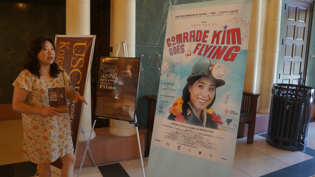 Elaine Kim, associate director of the Korean Studies Institute at USC, explains "Comrade Kim Goes Flying" during the Korean Film Festival Saturday.