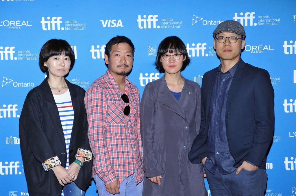 Speaks onstage at "City To City" press conference during the 2014 Toronto International Film Festival at TIFF Bell Lightbox on September 10, 2014. From right to left: Directors Kim Sung-hoon, Jung Joo-ri, Park Jung-beom, Bu Ji-young.